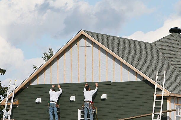 Professional Storm Damage Siding Repair technician working in Conneautville, PA